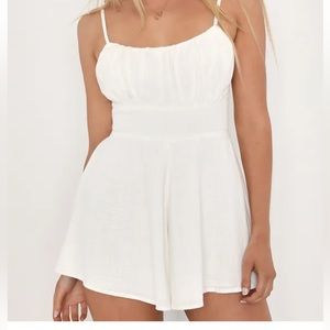 White lulus romper size XL. Does fit on the smaller side however